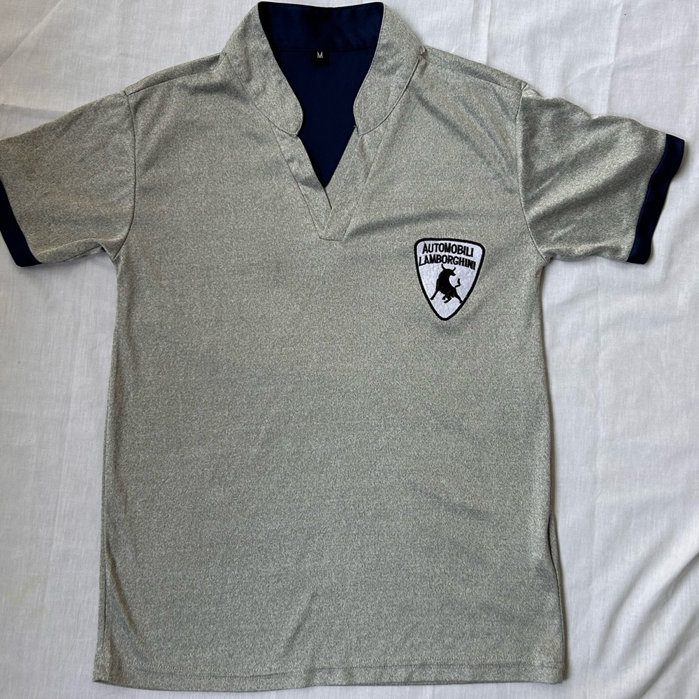 Women’s size M Lamborghini top. Excellent preowned condition